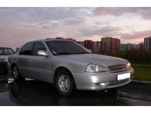 Характеристики автомобиля Kia Clarus 2.0 MT GLX (05.1998 - 11.2001): фото, вместимость, скорость, двигатель, топливо, масса, отзывы